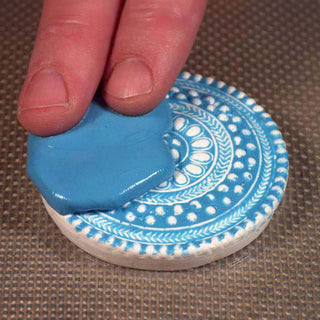 Applying Silicone Plastique Mold making Silicone Over a Textured Medallion