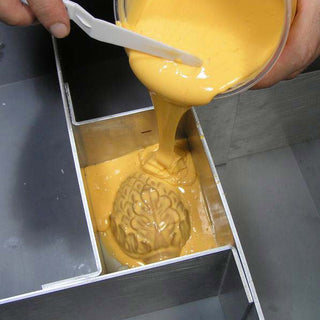 CopyFlex Liquid Food Grade Mold Making Silicone Being Poured Over an Object in a Mold Box