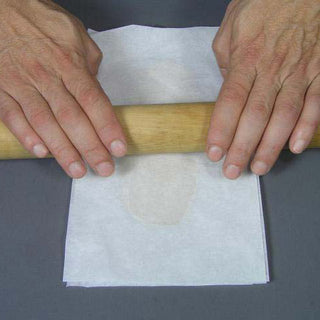Rolling Safe-D-Clay Between Two Sheets of Parchment Paper