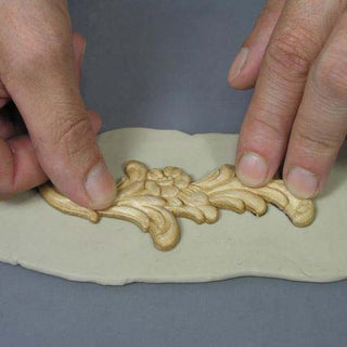 Wooden Applique Being Applied to Sheeted Safe-D-Clay in Order to Thicken the Object before Mold Making