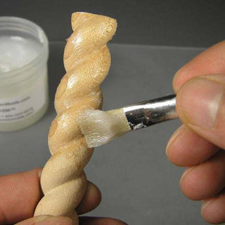 Mold-Dit Being Applied with a Brush to Seal a Porous Part Made From Wood